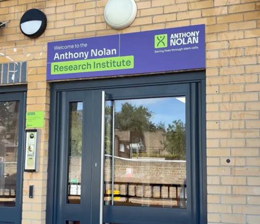 The front door of the Anthony Nolan Research Institute with colourful branding above
