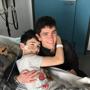 Daniel, in hospital, with his brother James.