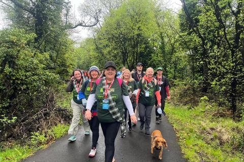 Group of women and dog walking 