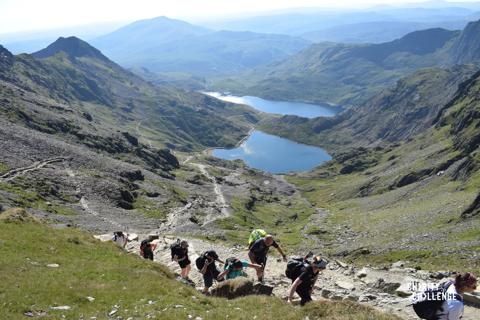 Photo of people trekking up a peak