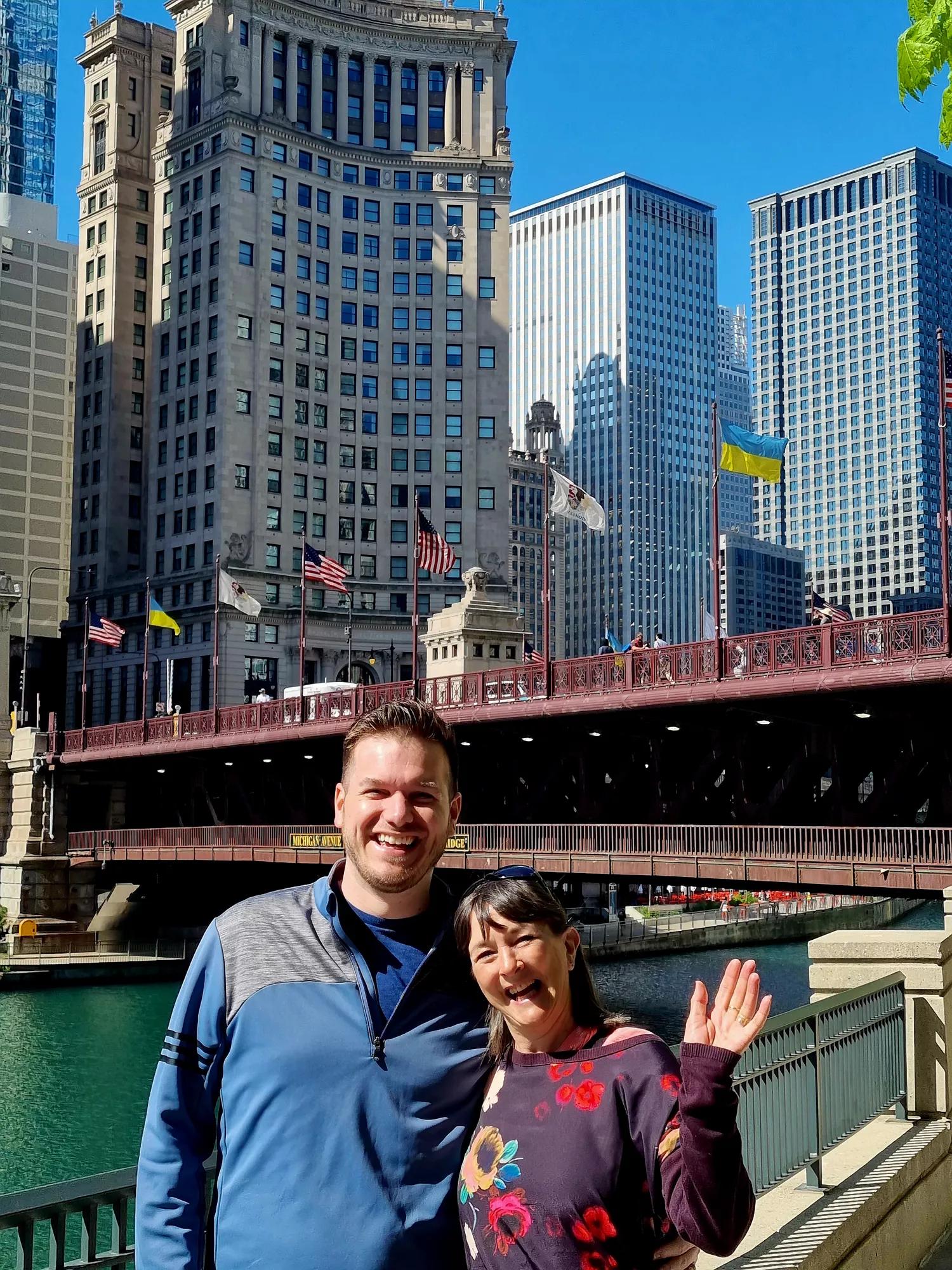 Photo of a patient smiling outdoors with a city backdrop