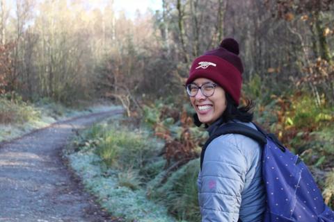 Michaela smiling at camera in hiking gear