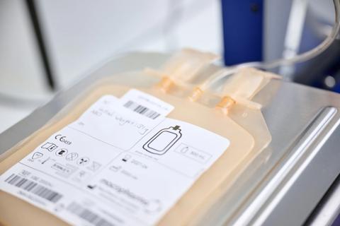 Sample bag sitting on digital scales.