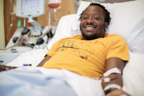 Young male stem cell donor in hospital bed