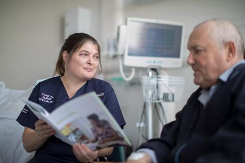 Debbie, Clinical Nurse Specialist, in hospital with a patient