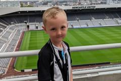 Leland at a football stadium