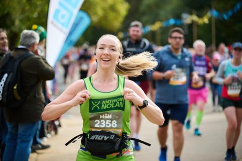 Royal Parks Half Marathon 2024 runner smiling 