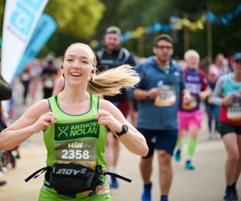 Royal Parks Half Marathon 2024 runner smiling 