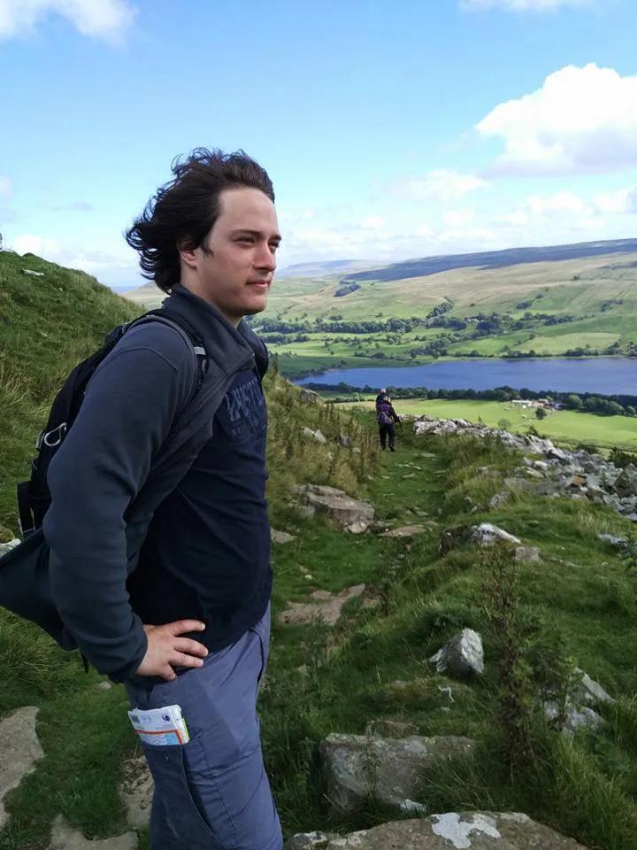 A person standing on a hilltop