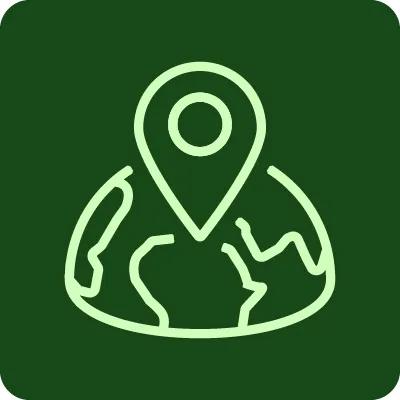 A green graphic icon of a pin in a world map