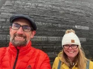 Man and woman on a walk smiling