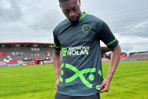 A man wearing an Anthony Nolan football shirt