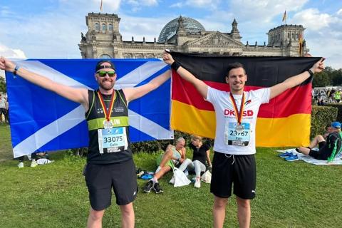 Anthony Nolan male supporter celebrating with his male donor after both completing the Berlin Marathon 