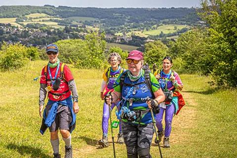 Photo of a group of people trekking up a hill for the Bath 50 Ultra Challenge