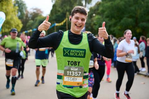 Royal Parks Half Marathon 2024 runner with thumbs up