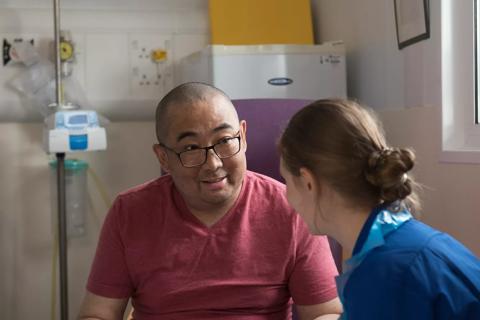 Patient (Xing Zhang) in Hospital ward with CNS Sarah Ware