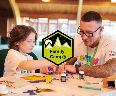 Father and daughter doing crafts at family camp