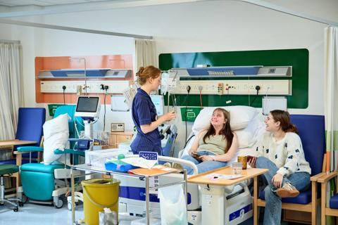 A Health Care Practioner talking to one of our stem cell donors who is currently donating their stem cells at our cell collection centre
