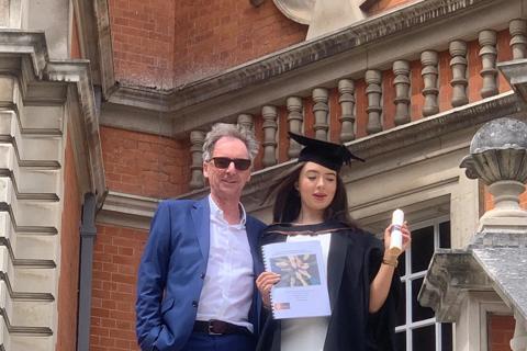 A photo of Philip and his daughter, Issey, at her  graduation