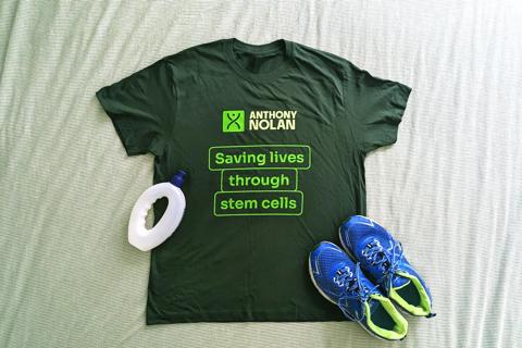 The Anthony Nolan supporter dark green tshirt that says 'Saving lives through stem cells' alongside a running water bottle and running trainers