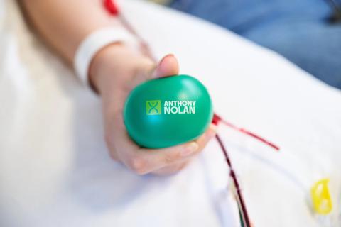 Donor holds Anthony Nolan branded stress ball.