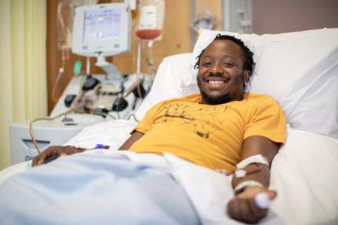 Young male stem cell donor in hospital bed