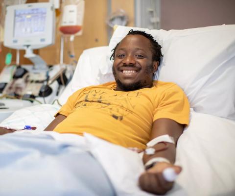 Young male stem cell donor in hospital bed