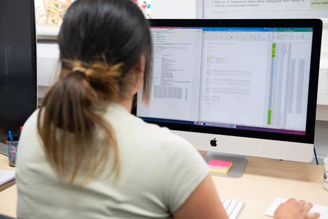 Research Assistant in Bioinformatics working at computer