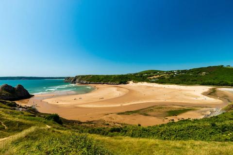 Photo of the Gower Peninsula with bright blue skies and 