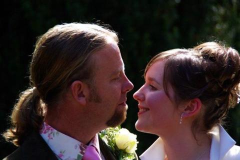 Male patient with his wife on their wedding day