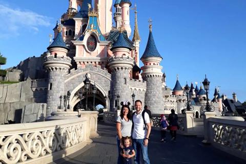 Alex with his family on a trip to Disnelyand