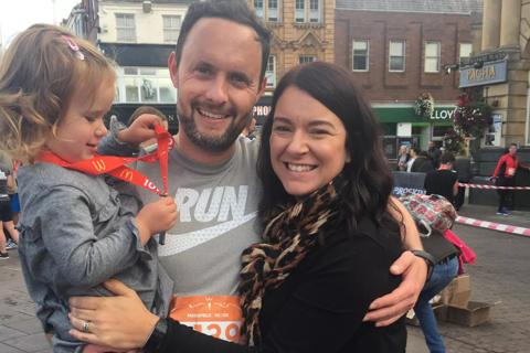 Alex, with his wife and daughter.