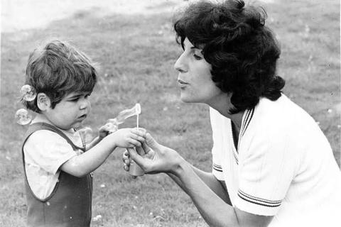 Shirley and Anthony blowing bubbles