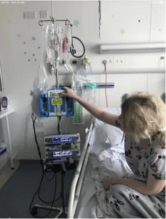 a young woman with blonde hair in a hospital bed