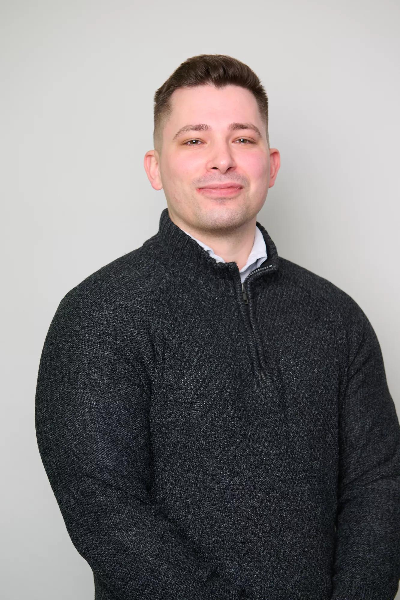 A headshot of Tomos Llody Roberts