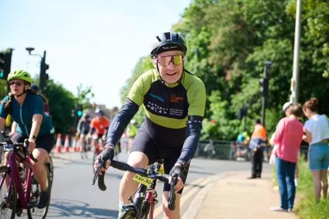 Man riding his bike in his Anthony Nolan cycling jersey for the 2023 RideLondon