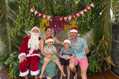 Jake, his wife and two sons having a photo taken with Santa